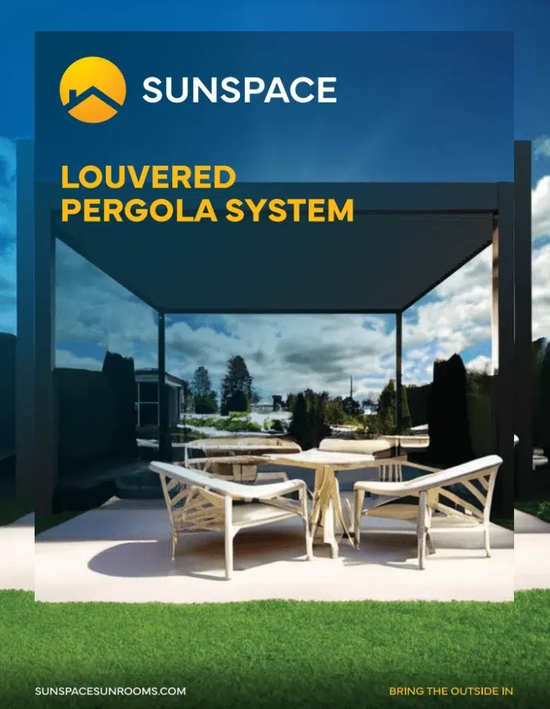Louvered pergola system by Sunspace, showcasing modern design, outdoor seating area, and vibrant sky, emphasizing durability and style for enhancing outdoor spaces.