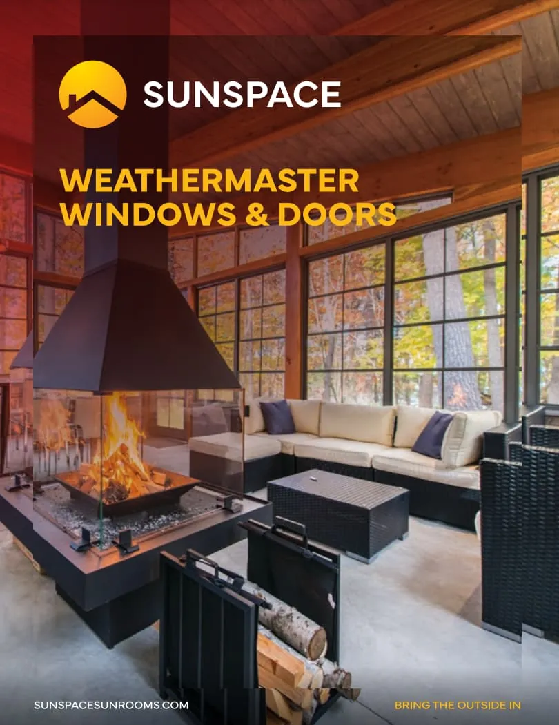 Sunspace WeatherMaster Windows and Doors showcased in a cozy interior setting with a modern fireplace, emphasizing energy efficiency and aesthetic appeal for homes.