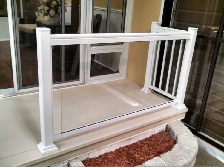 Stylish white railing system with glass panels, enhancing outdoor living space, suitable for sunrooms and screen rooms.